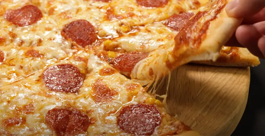 How to Make Perfect Homemade Pizza! Best Pizza Recipe You'll Ever Eat at Home - 6 Steps 1 JOXIQ A ball of freshly made easy pizza dough on a floured surface, ready for rolling.