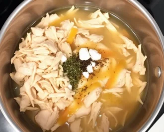 Creamy chicken and rice bake fresh from the oven with golden cheese topping.