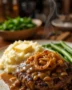 Homemade hamburger steak with onions and rich brown gravy served on a plate